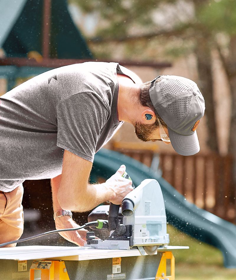 Matthew slicing wooden plank