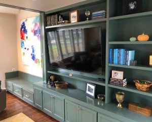 Wooden shelves in a Tv room