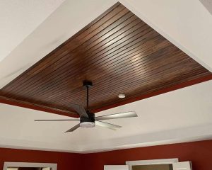 Wooden ceiling in a room and celling fan