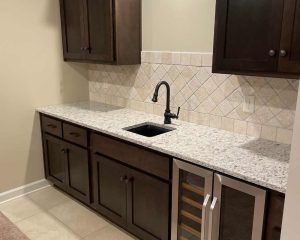 Sink with wooden cabinets around