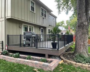 Backyard of a house with trees and deck