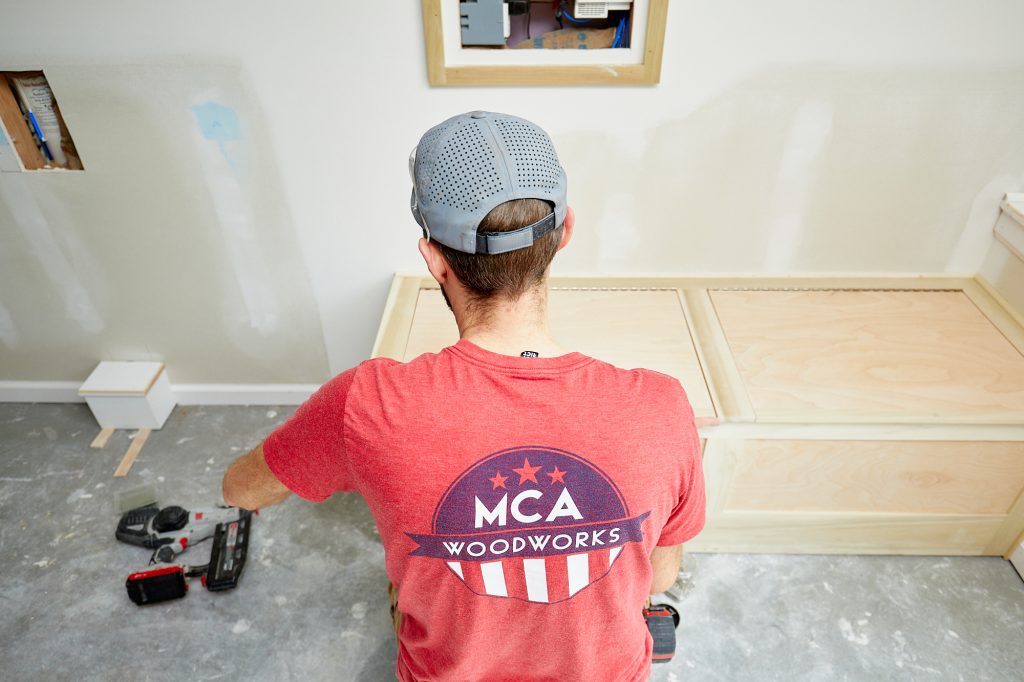 MCA wood works worker working on custom cabinets